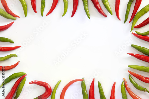 Flat lay red hot chillii peppers pattern isolated on white with clipping path. Red spicy chili peppers wallpaper pattern. Top view or flat lay.