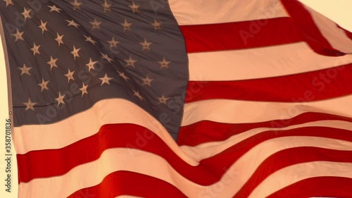 Majestic American Flag Waving In The Wind, red white and blue, US American flag. Background for Inauguration, Memorial Day, Veteran's Day, 4th of July, or other patriotic USA holiday photo