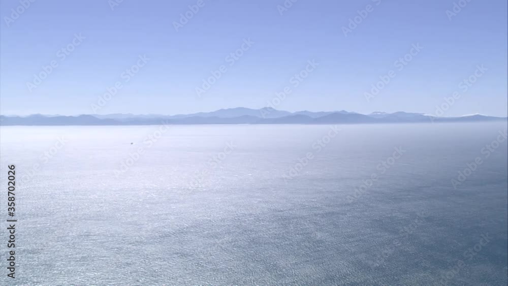 Ocean with land in distance Ocean with land in distance