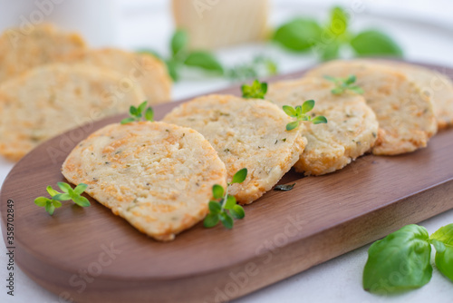 home made cheese crackers with herbs on a table