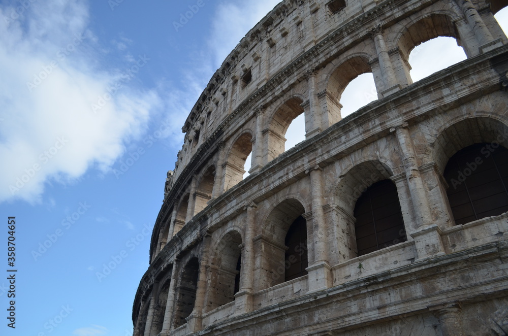 Amazing view of the Building  of roman building of the Roman Coliseum with blue cloudy sky