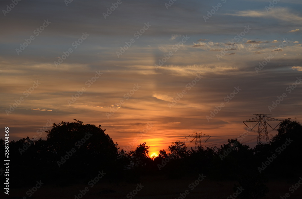 Amazing Sunrise with mountains forests and clouds with Blue orange saffron golden sky Amazing Sunrise with mountains forests and clouds with Blue orange saffron golden sky