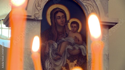 Candle and Christian Orthodox icon