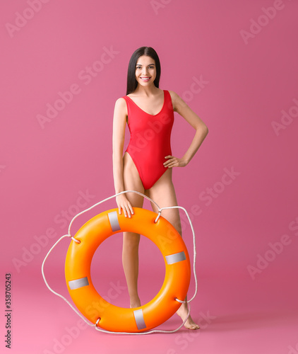 Beach rescuer with lifebuoy...