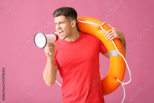 Beach rescuer with lifebuoy...