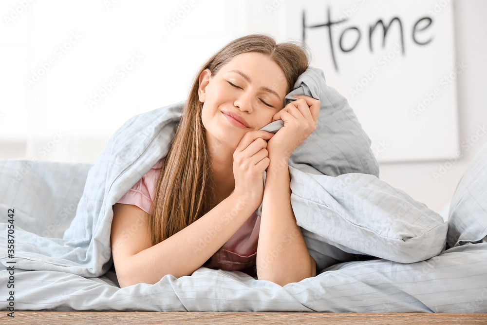 Morning of beautiful young woman in bedroom Morning of beautiful young woman in bedroom