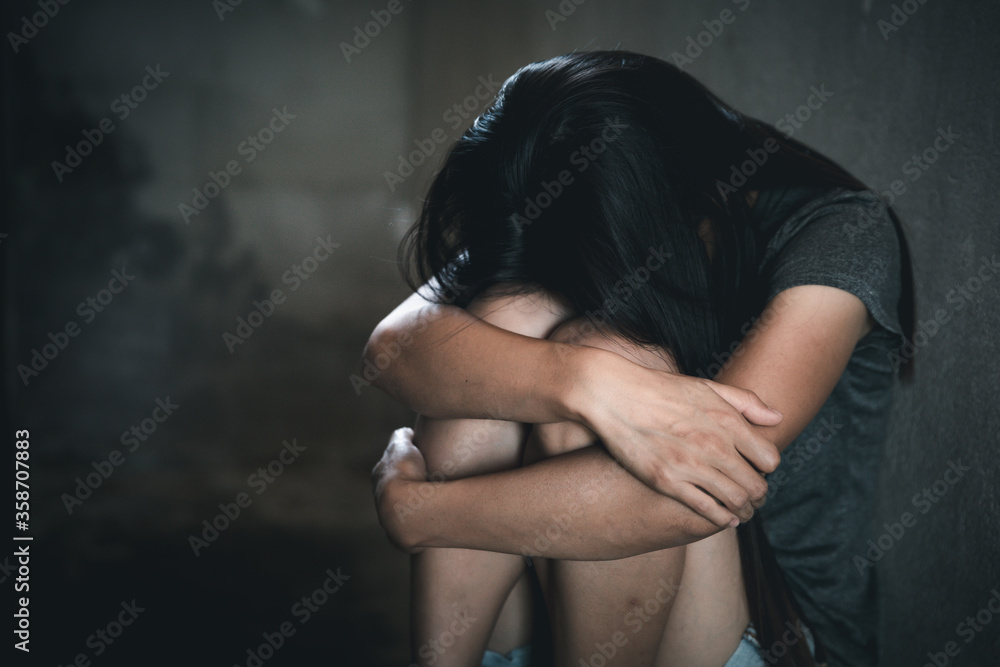 Young depressed woman, and rape violence,beaten and raped sitting in the corner, Copy space. International Women's Day Stock Photo | Adobe Stock