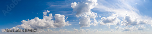 Wide sky panorama with scattered cumulus clouds photo