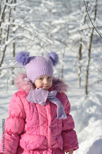 A girl walks through a winter snow-covered forest  © Мария Иванова