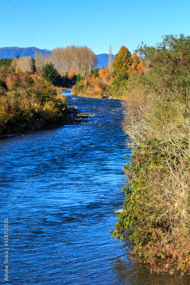 The Tongariro River, New Zealand, in autumn. This is a popular location for trout fishing The Tongariro River, New Zealand, in autumn. This is a popular location for trout fishing