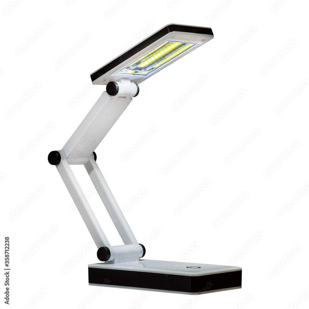 LED table lamp in the on state. Isolated on white background LED table lamp in the on state. Isolated on white background