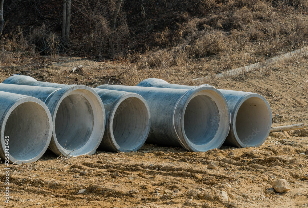 Concrete culverts on ground of new construction site. Concrete culverts on ground of new construction site.