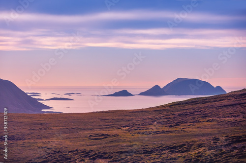 Beautiful rocky seascape in the evening. Rocks in the sea at sunset. Wilderness, beautiful nature of Norway, Europe