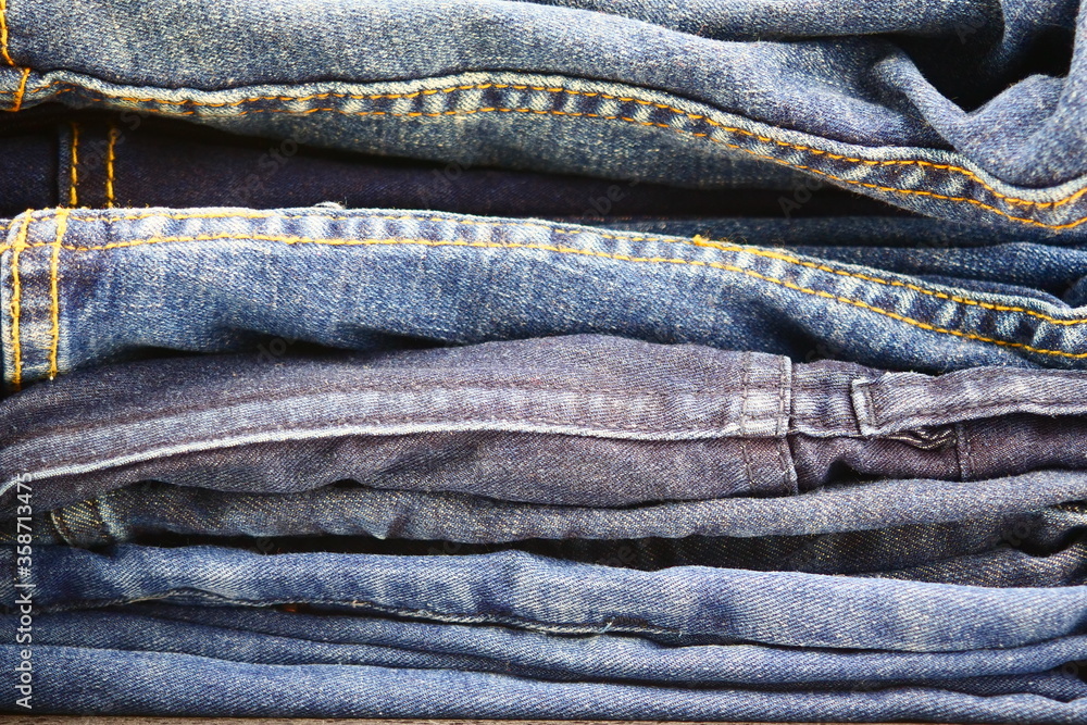 stack of blue jeans