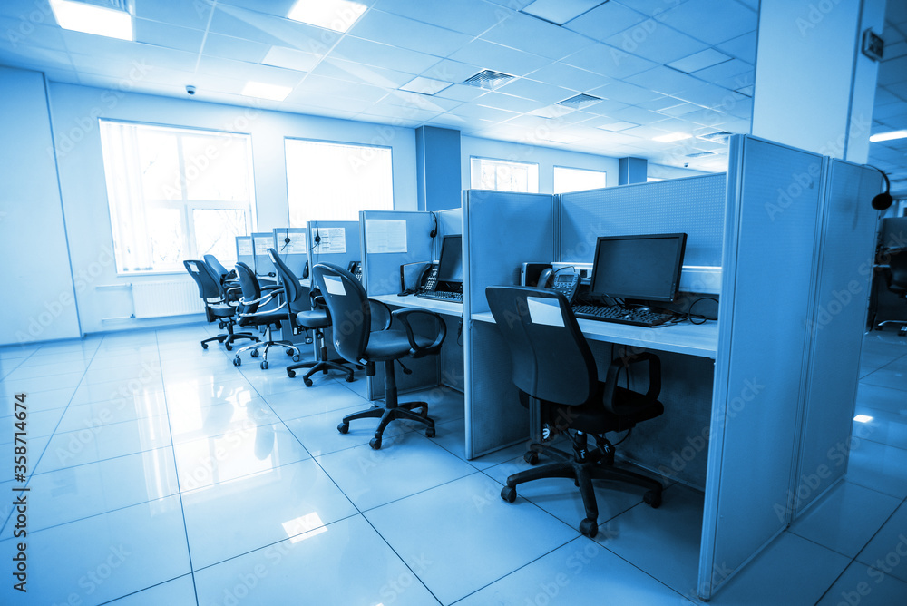 workplace with computer and headphone in a call center. vacancies after a pandemic. work as an assistant in working with applications workplace with computer and headphone in a call center. vacancies after a pandemic. work as an assistant in working with applications