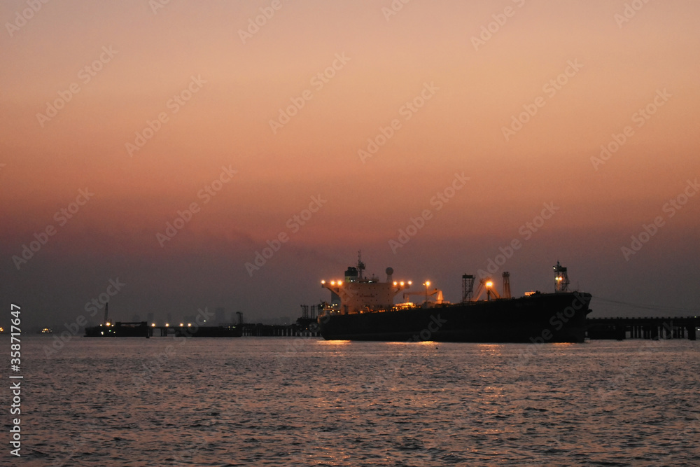 A merchant ship standing near the Port of Mumbai, captured in evening. A merchant ship standing near the Port of Mumbai, captured in evening.