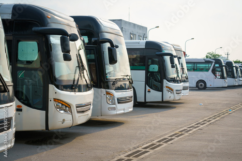 City buses in the parking lot at the bus station