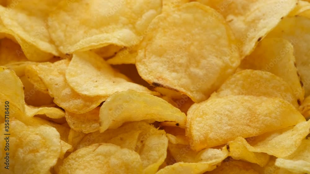 craft golden potato chips rotating close up craft golden potato chips rotating close up