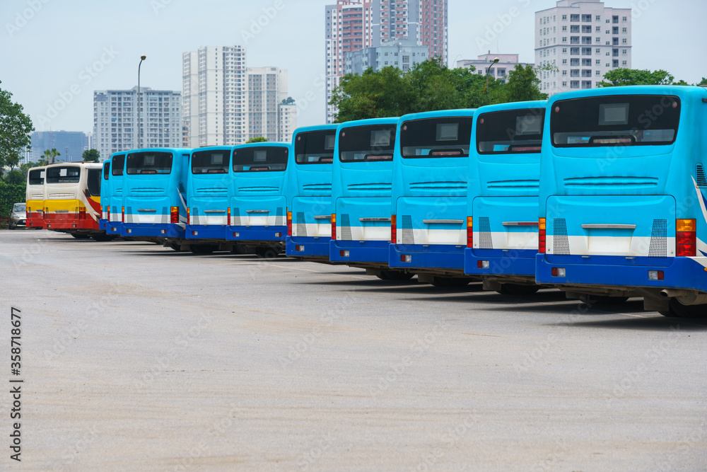 City buses in the parking lot at the bus station