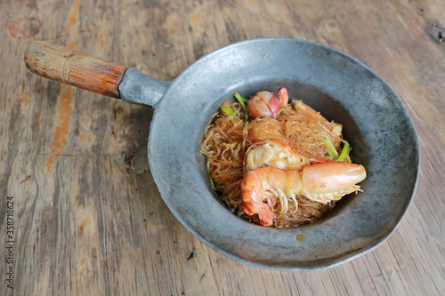 Baked shrimp vermicelli in fry pan, Top view photo