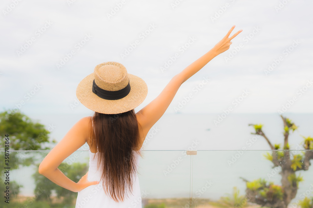 Portriat beautiful young asian woman happy smile around balcony with sea view