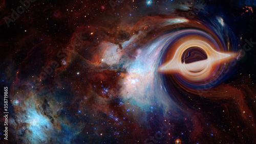 Fototapeta Naklejka Na Ścianę i Meble -  Black hole in deep space. Elements of this image furnished by NASA