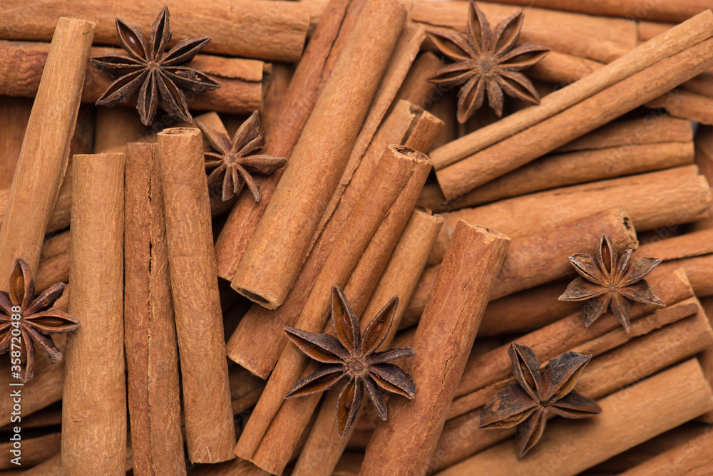 Photo of cinnamon sticks and anise stars macro background Photo of cinnamon sticks and anise stars macro background
