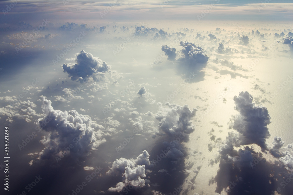 Naklejka premium Blue sky with white clouds from the plane view.Cumulus clouds.