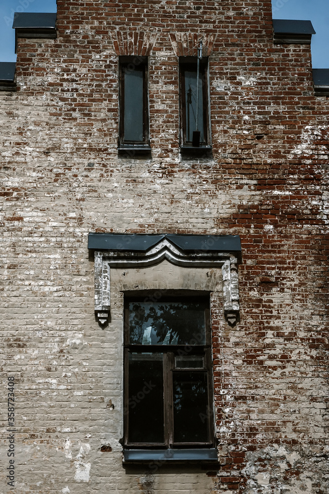 Old brick wall with beautiful windows on an abandoned building Old brick wall with beautiful windows on an abandoned building
