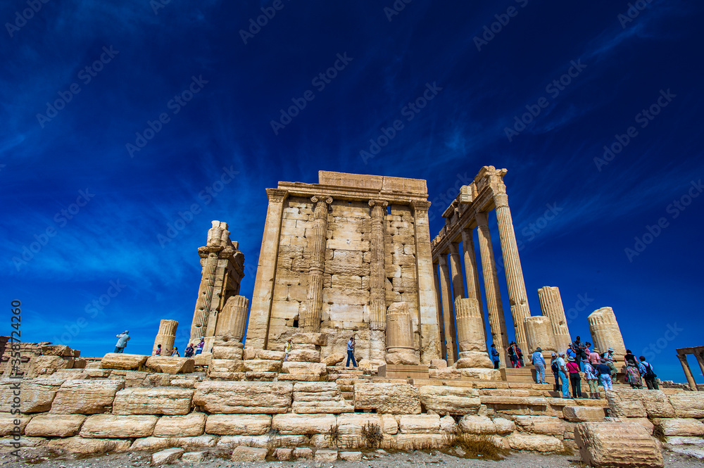 It's Temple of Bel , an ancient stone ruin located in Palmyra, Syria.