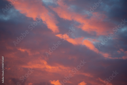 Abstract background of evening sky with clouds. © penyushkin