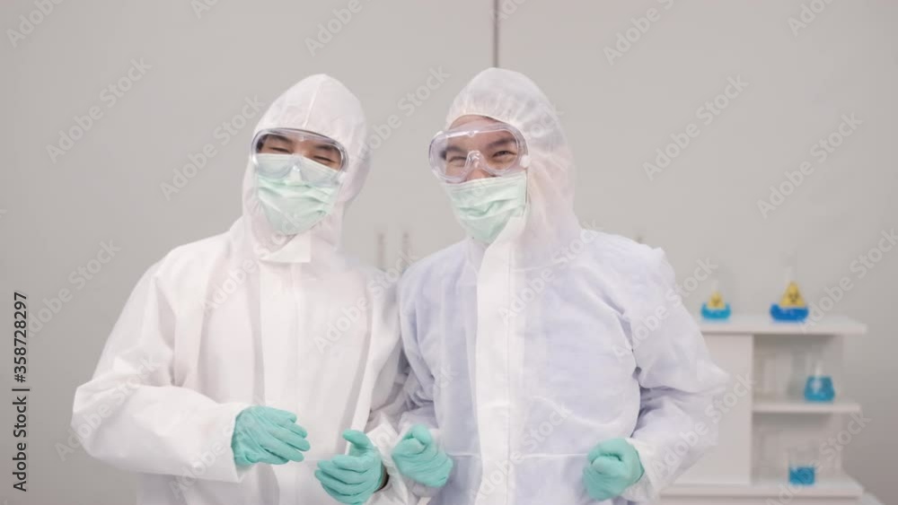 Group of Scientists with a microscope in laboratory, developing a vaccine Group of Scientists with a microscope in laboratory, developing a vaccine