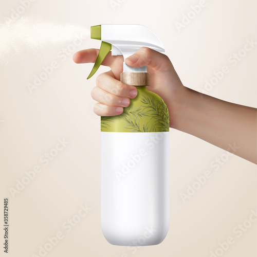 Hand holding a disinfectant spray