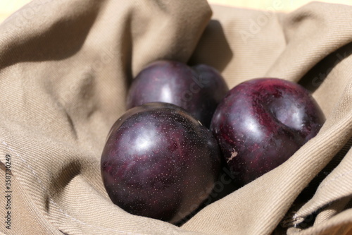 Looks like purple plums, but they are pluots or plumcots, a cross between plums and apricots