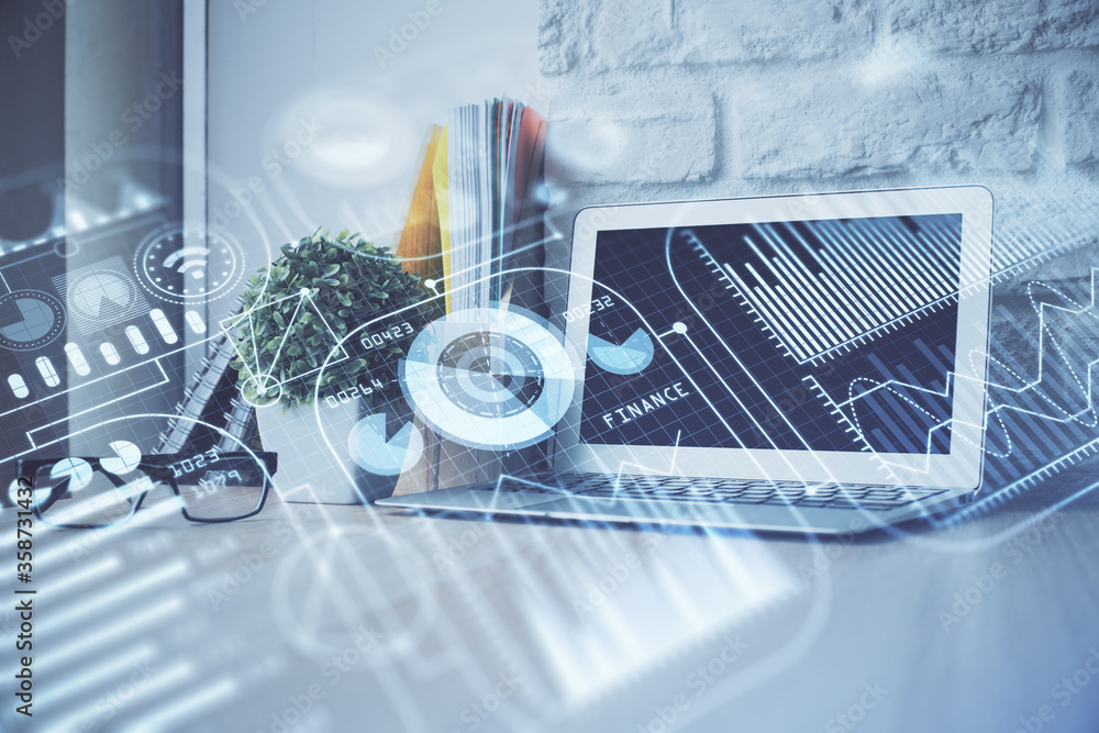 Computer on desktop in office with technology theme hologram. Multi exposure. Tech concept. Computer on desktop in office with technology theme hologram. Multi exposure. Tech concept.
