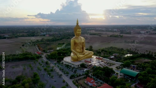 Aerial footage from a drone of the Big Buddha statue at Wat Muang, Ang Thong Province, Thailand