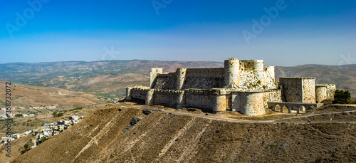 It's Krak des Chevaliers, also Crac des Chevaliers, is a Crusader castle in Syria and one of the most important preserved medieval castles in the world.