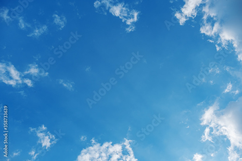 photo of clouds on a blue sky background arranged like a frame  Space for copy