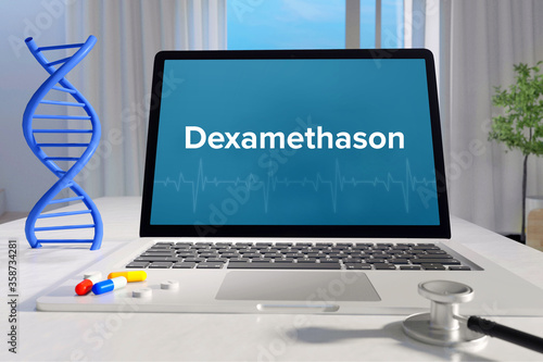 Dexamethason (COVID-19). Laptop mit Begriff/Text auf Monitor. Computer von Arzt im Büro. DNA und Stethoskop. Medizin, Gesundheitswesen photo