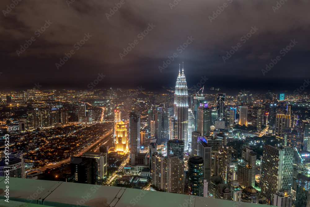 Kuala Lumpur, Federal Territory / Malaysia - February 25, 2017: Aerial view of KLCC and Kuala Lumpur with buildings lights on in evening.
