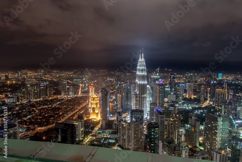 Kuala Lumpur, Federal Territory / Malaysia - February 25, 2017: Aerial view of KLCC and Kuala Lumpur with buildings lights on in evening. photo