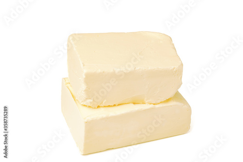 Block of butter isolated on white background