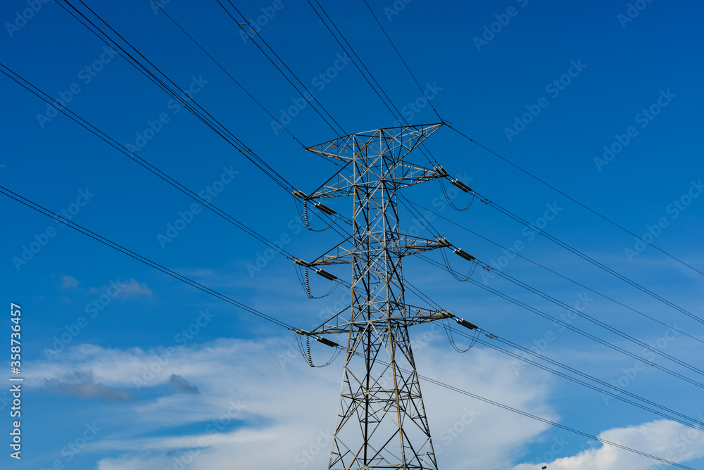 Kuching, Sarawak / Malaysia - August 28, 2017: Power pole and cables in blue sky.