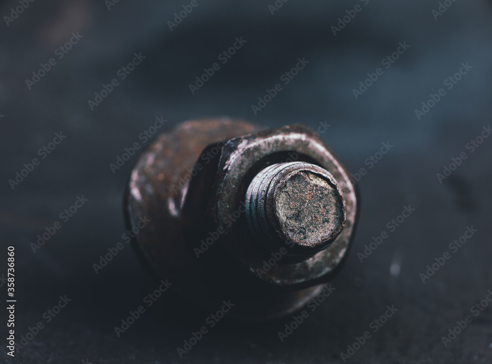 bolt and nut on a dark background bolt and nut on a dark background