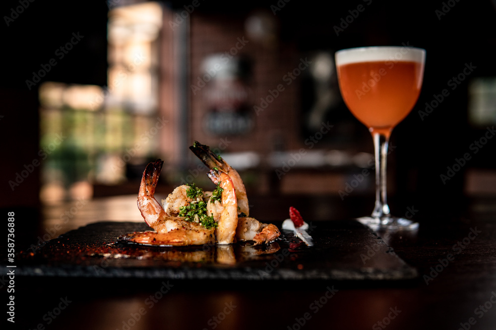 Amazing Prawns dish with orange cocktail Amazing Prawns dish with orange cocktail