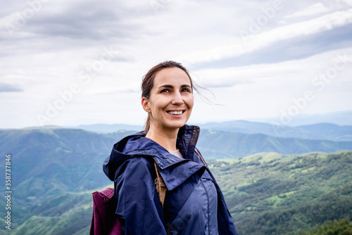 Beautiful woman smiling in nature. Happy people lifestyle.