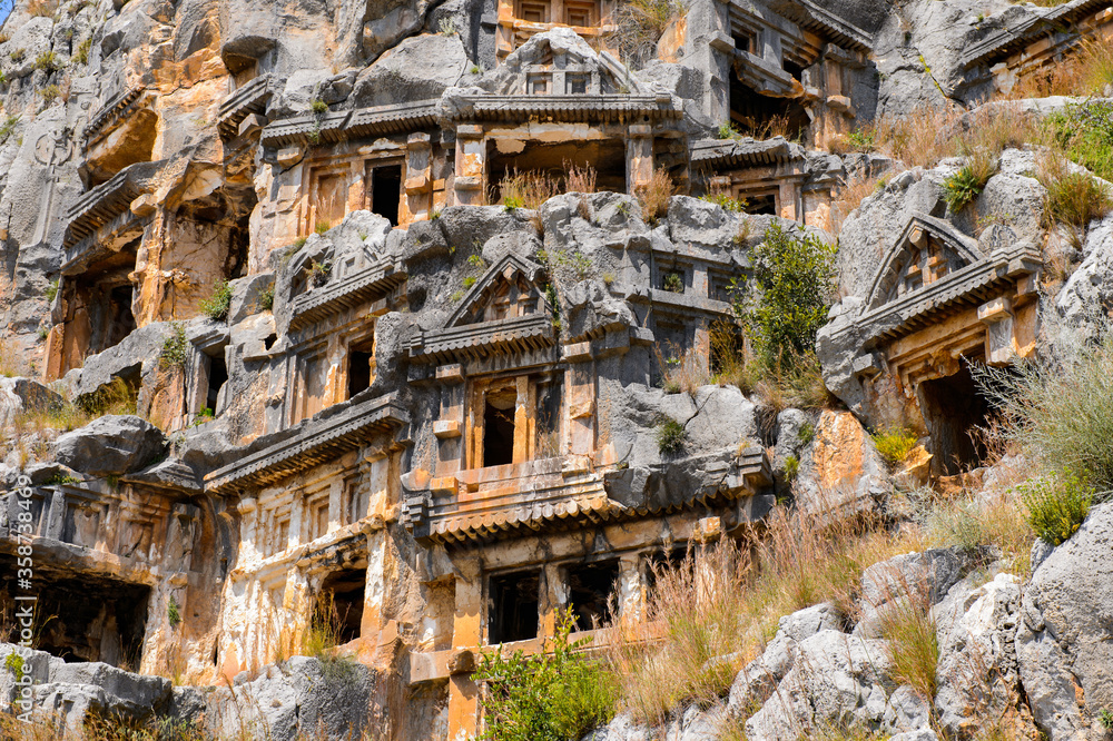 Obraz premium It's Ancient rock cut tombs of the Lycian necropolis, Myra, Turkey