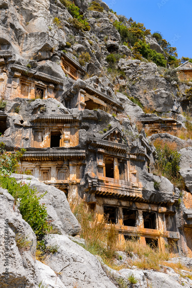 It's Ancient rock cut tombs of the Lycian necropolis, Myra, Turkey