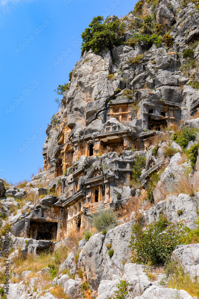 Naklejka premium It's Rock cut tombs of the ancient Lycian necropolis, Myra, Turkey