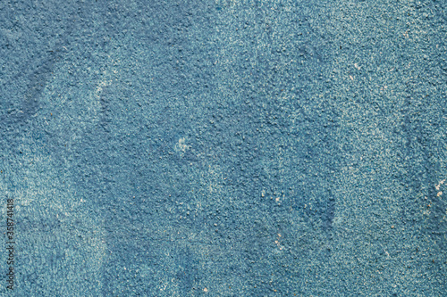 Details of the blue concrete wall texture for background.